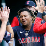 Jose Ramirez #11 of the Cleveland Guardians celebrates with teammates after scoring against the Detroit Tigers on a single by Josh Naylor during the seventh inning at Comerica Park on May 28, 2022, in Detroit, Michigan.
