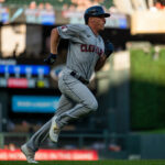 Myles Straw #7 of the Cleveland Guardians scores a run in the third inning of the game against the Minnesota Twins at Target Field on June 22, 2022 in Minneapolis, Minnesota.