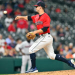 Ernie Clement #28 of the Cleveland Guardians pitches during the ninth inning against the Minnesota Twins at Progressive Field on June 27, 2022 in Cleveland, Ohio. The Twins defeated the Guardians 11-1.