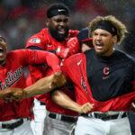 Richie Palacios #9, Franmil Reyes #32 and Josh Naylor #22 of the Cleveland Guardians celebrate a walk off two-run home run by Naylor during the tenth inning to defeat the Minnesota Twins 7-6 at Progressive Field on June 29, 2022 in Cleveland, Ohio.