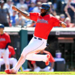 Franmil Reyes #32 of the Cleveland Guardians scores on a two-run infield single hit by Myles Straw during the eighth inning against the Minnesota Twins at Progressive Field on June 30, 2022 in Cleveland, Ohio.