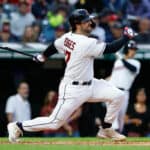 Austin Hedges #17 of the Cleveland Guardians hits an RBI single off Dane Dunning #33 of the Texas Rangers during the second inning at Progressive Field on June 08, 2022 in Cleveland, Ohio.