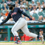 Franmil Reyes #32 of the Cleveland Guardians hits a sacrifice fly ball to drive in Amed Rosario against the Detroit Tigers during the first inning at Comerica Park on July 5, 2022, in Detroit, Michigan.