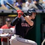 Nolan Jones #33 of the Cleveland Guardians hits a single in the fifth inning against the Kansas City Royals at Kauffman Stadium on July 10, 2022 in Kansas City, Missouri.