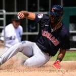 Amed Rosario #1 of the Cleveland Guardians slides home to score in the fifth inning against the Chicago White Sox during game one of a doubleheader at Guaranteed Rate Field on July 23, 2022 in Chicago, Illinois.