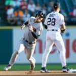 Steven Kwan #38 of the Cleveland Guardians rounds second base past Javier Baez #28 of the Detroit Tigers on a triple during the first inning at Comerica Park on August 10, 2022, in Detroit, Michigan.