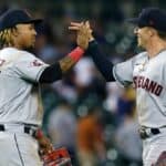 Jose Ramirez #11 of the Cleveland Guardians celebrates with Myles Straw #7 after a win over the Detroit Tigers at Comerica Park on August 10, 2022, in Detroit, Michigan.