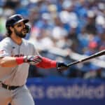 Austin Hedges #17 of the Cleveland Guardians hits an RBI double to bring home Tyler Freeman #2 in the fourth inning of their MLB game against the Toronto Blue Jays at Rogers Centre on August 14, 2022 in Toronto, Canada.