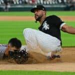 Jose Abreu #79 of the Chicago White Sox slides in the ninth inning to get the final out of the game against Andres Gimenez #0 of the Cleveland Guardians at Guaranteed Rate Field on May 10, 2022 in Chicago, Illinois.