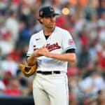 Starting pitcher Shane Bieber #57 of the Cleveland Guardians reacts after giving up a two-run homer during the fifth inning to Ozzie Albies #1 of the Atlanta Braves at Progressive Field on July 04, 2023 in Cleveland, Ohio.