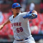 Carlos Carrasco #59 of the New York Mets delivers a pitch against the St. Louis Cardinals in the first inning at Busch Stadium on August 20, 2023 in St Louis, Missouri.