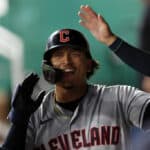 Bo Naylor #23 of the Cleveland Guardians is congratulated by teammates in the dugout after hitting home run during the 8th inning of the game against the Kansas City Royals at Kauffman Stadium on September 19, 2023 in Kansas City, Missouri.