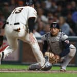 Base runner Austin Slater #13 of the San Francisco Giants is tagged out at home plate by catcher Bo Naylor #23 of the Cleveland Guardians in the bottom of the seventh inning at Oracle Park on September 11, 2023 in San Francisco, California.