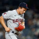 James Karinchak #99 of the Cleveland Guardians jogs to the dugout after coming out of the game during the seventh inning against the New York Yankees at Yankee Stadium on May 02, 2023 in the Bronx borough of New York City.