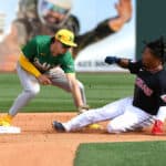 Jose Ramirez #11 of the Cleveland Guardians is tagged out while attempting to steal second base by Zack Gelof #20 of the Oakland Athletics during the fourth inning of a spring training game at Goodyear Ballpark on February 27, 2024 in Goodyear, Arizona.