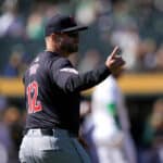 Manager Stephen Vogt #12 of the Cleveland Guardians signals the bullpen to make a pitching change against the Oakland Athletics in the bottom of the ninth inning on March 31, 2024 at the Oakland Coliseum in Oakland, California.
