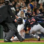 Ty France #23 of the Seattle Mariners is tagged out at home plate by Bo Naylor #23 of the Cleveland Guardians during the fourth inning at T-Mobile Park on April 01, 2024 in Seattle, Washington.