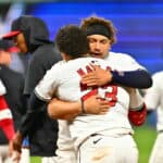 Bo Naylor #23 of the Cleveland Guardians gets a hug from his brother Josh Naylor #22 after Bo hit a walk-off RBI single in the tenth inning against the Chicago White Sox at Progressive Field on April 10, 2024, in Cleveland, Ohio. Josh knocked in the tying run in the prior at-bat with a double. The Guardians won 7-6.