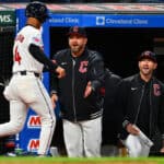 Brayan Rocchio #4 celebrates with manager Stephen Vogt #12 and bench coach Craig Albernaz #55 of the Cleveland Guardians after Rocchio scored during the fifth inning against the Oakland Athletics at Progressive Field on April 19, 2024 in Cleveland, Ohio.