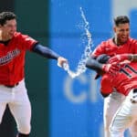 Will Brennan #17, Brayan Rocchio #4 and José Ramírez #11 of the Cleveland Guardians celebrate a walk off RBI single hit by Rocchio to defeat the Detroit Tigers 5-4 in ten innings at Progressive Field on May 08, 2024 in Cleveland, Ohio.