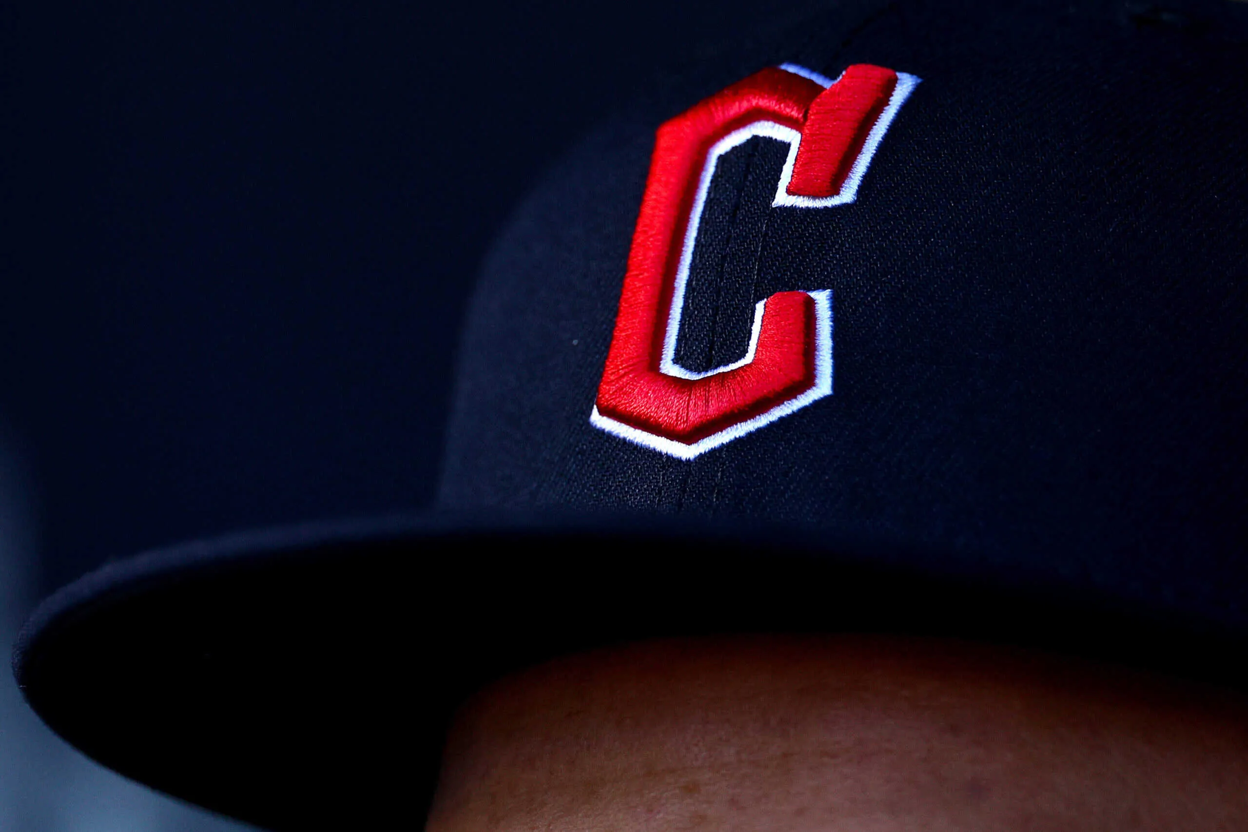 NEW YORK, NEW YORK - OCTOBER 18: A detailed view of a Cleveland Guardians hat in game five of the American League Division Series against the New York Yankees at Yankee Stadium on October 18, 2022 in New York, New York.