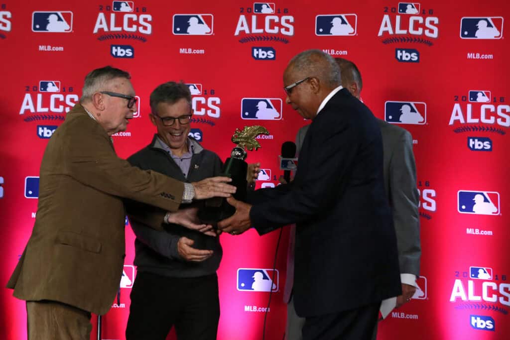 TORONTO, ON - OCTOBER 19: Owner Larry Dolan of the Cleveland Indians is handed the William Harridge Trophy after defeating the Toronto Blue Jays in game five to win the American League Championship Series at Rogers Centre on October 19, 2016 in Toronto, Canada.