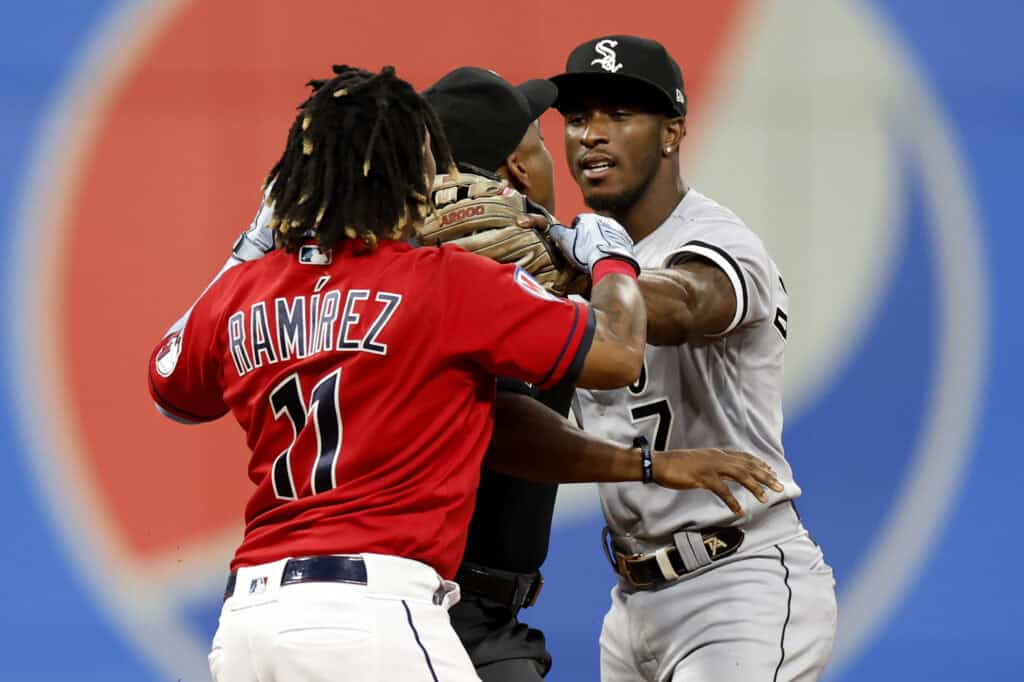 CLEVELAND, OH - AUGUST 05: Jose Ramirez #11 of the Cleveland Guardians and Tim Anderson #7 of the Chicago White Sox start to fight as umpire Malachi Moore #44 gets between them during the sixth inning at Progressive Field on August 05, 2023 in Cleveland, Ohio.