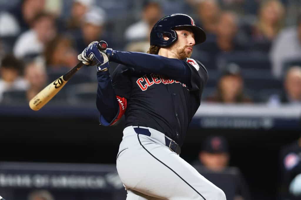 NEW YORK, NEW YORK - AUGUST 20: Daniel Schneemann #10 of the Cleveland Guardians hits a RBI single in the third inning against the New York Yankees at Yankee Stadium on August 20, 2024 in New York City.