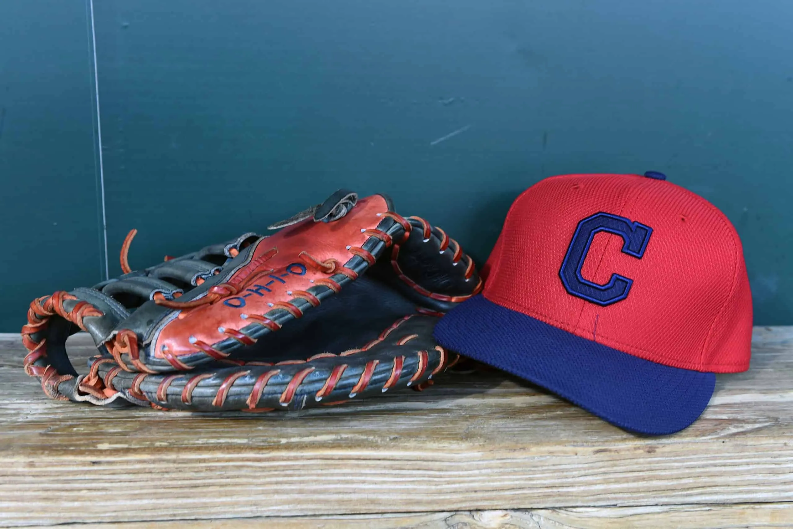 BALTIMORE, MD - JUNE 26: A Cleveland Indians cap and glove sit in the dug out before a baseball game between the Baltimore Orioles and the Cleveland Indians at Oriole Park at Camden Yards on June 26, 2015 in Baltimore, Maryland.