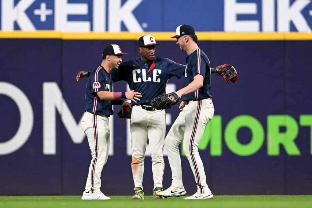 CLEVELAND, OHIO - SEPTEMBER 12: Steven Kwan #38, Angel Martínez #1 and Nolan Jones #22 of the Cleveland Guardians celebrate the team's 4-0 win over the Chicago White Sox at Progressive Field on September 12, 2025 in Cleveland, Ohio.