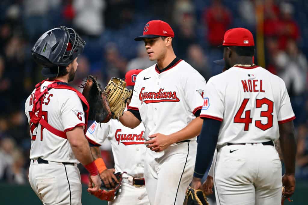 CLEVELAND, OHIO - SEPTEMBER 09: Catcher Austin Hedges #27 celebrates with starting pitcher Joey Cantillo #54 of the Cleveland Guardians as Cantillo leaves the game during the ninth inning against the Kansas City Royals at Progressive Field on September 09, 2025 in Cleveland, Ohio. The Guardians defeated the Royals 2-0.