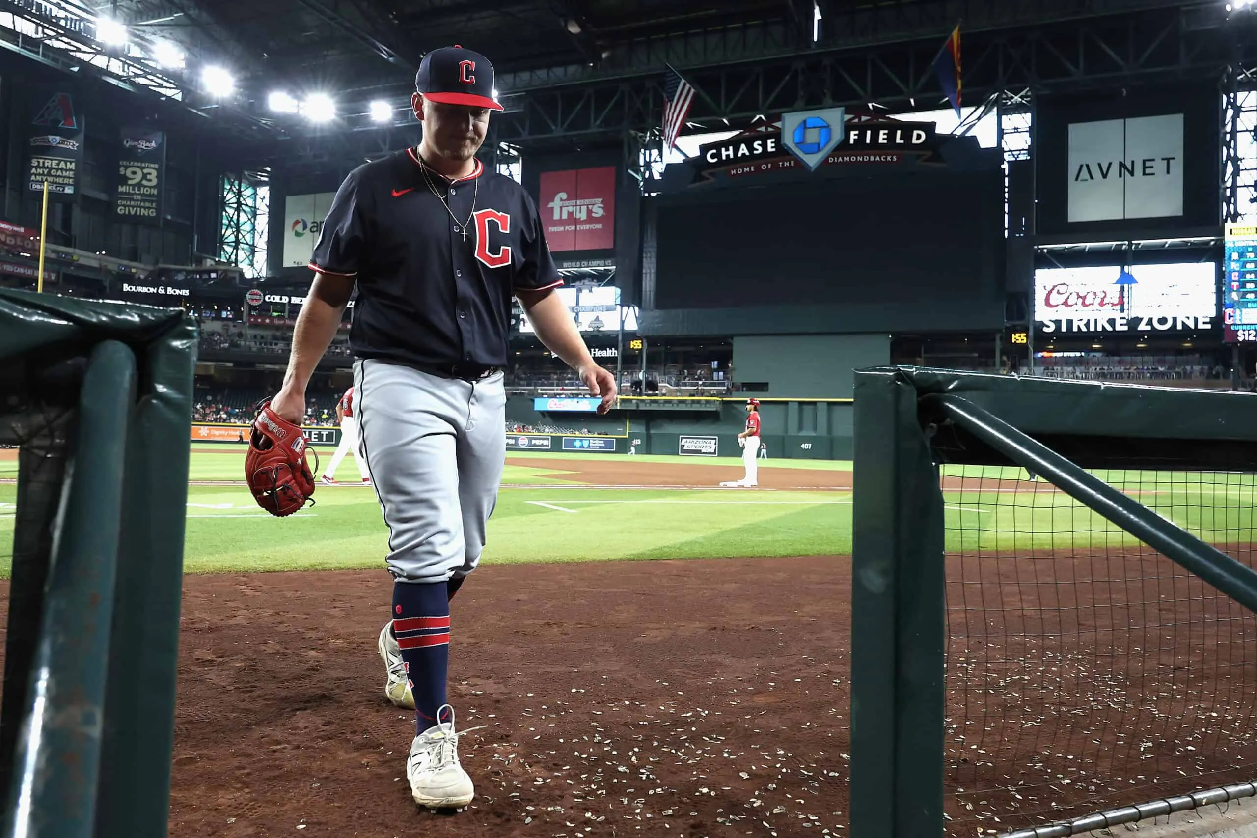 PHOENIX, ARIZONA - AUGUST 20: Starting pitcher Parker Messick #77 of the Cleveland Guardians walks to the dugout after being removed during the seventh inning of the MLB game against the Arizona Diamondbacks at Chase Field on August 20, 2025 in Phoenix, Arizona.