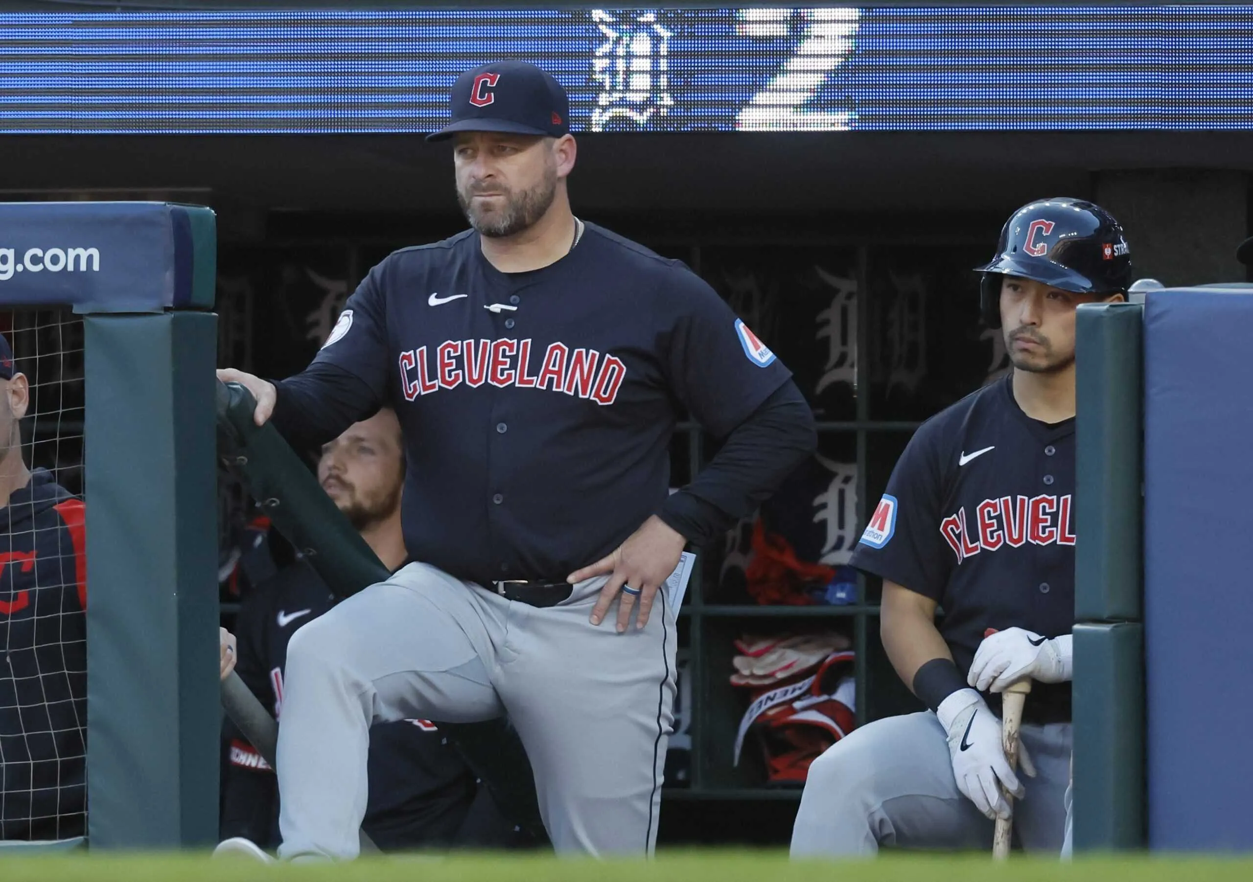 DETROIT, MI - OCTOBER 9: Manager Stephen Vogt #12 of the Cleveland Guardians and left fielder Steven Kwan #38 watch from the dugout during the ninth inning of Game Three of the Division Series against the Detroit Tigers at Comerica Park on October 9, 2024 in Detroit, Michigan.