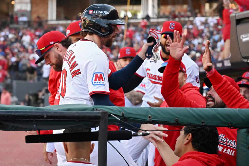 CLEVELAND, OHIO - OCTOBER 01: Daniel Schneemann #10 of the Cleveland Guardians celebrates with teammates during the eighth inning against the Detroit Tigers in game two of the American League Wild Card Series at Progressive Field on October 01, 2025 in Cleveland, Ohio.
