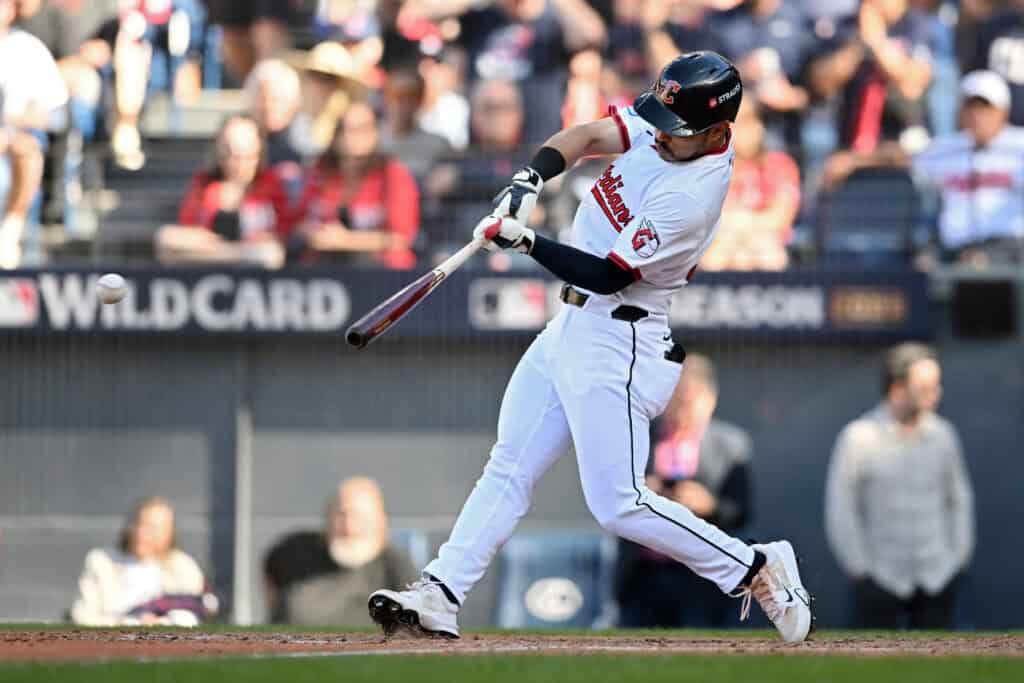 CLEVELAND, OHIO - OCTOBER 01: Steven Kwan #38 of the Cleveland Guardians hits a double during the eighth inning against the Detroit Tigers in game two of the American League Wild Card Series at Progressive Field on October 01, 2025 in Cleveland, Ohio.