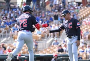 GLENDALE, ARIZONA - FEBRUARY 24: Travis Bazzana #72 of the Cleveland Guardians celebrates with third base coach Rouglas Odor #53 after hitting a three run home run against the Los Angeles Dodgers during the second inning of a spring training game at Camelback Ranch on February 24, 2026 in Glendale, Arizona.