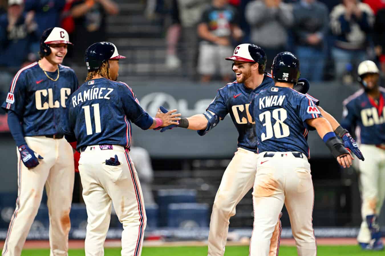 CLEVELAND, OHIO - APRIL 17: Chase DeLauter #24, José Ramírez #11, Daniel Schneemann #10 and Steven Kwan #38 of the Cleveland Guardians celebrate after they all scored on a grand slam home run by Schneemann during the seventh inning against the Baltimore Orioles at Progressive Field on April 17, 2026 in Cleveland, Ohio