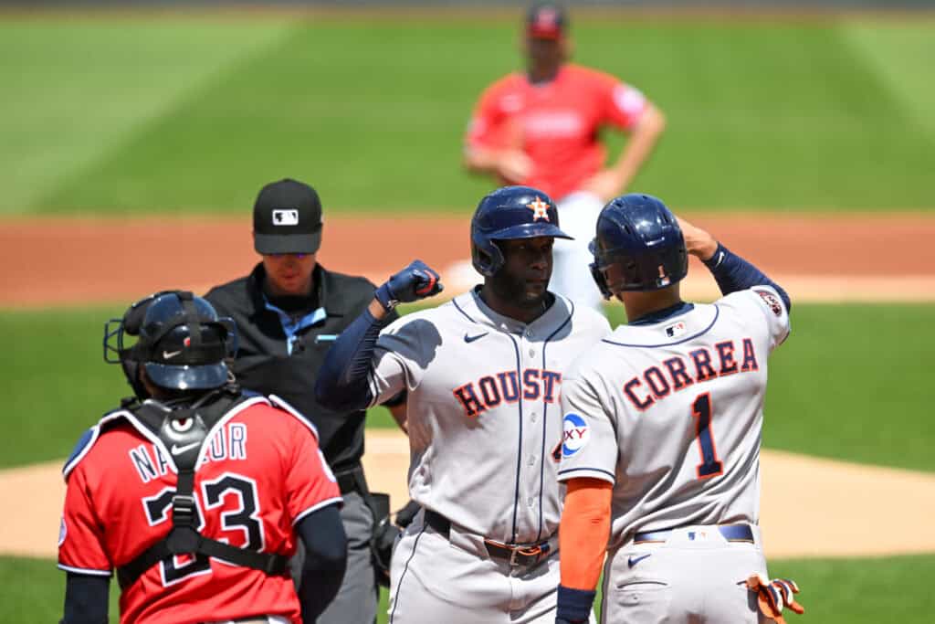CLEVELAND, OHIO - APRIL 22: Yordan Alvarez #44 and Carlos Correa #1 of the Houston Astros celebrate scoring on a two-run home run hit by Alvarez during the first inning against the Cleveland Guardians at Progressive Field on April 22, 2026 in Cleveland, Ohio.