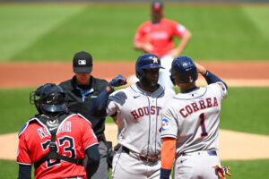 CLEVELAND, OHIO - APRIL 22: Yordan Alvarez #44 and Carlos Correa #1 of the Houston Astros celebrate scoring on a two-run home run hit by Alvarez during the first inning against the Cleveland Guardians at Progressive Field on April 22, 2026 in Cleveland, Ohio.