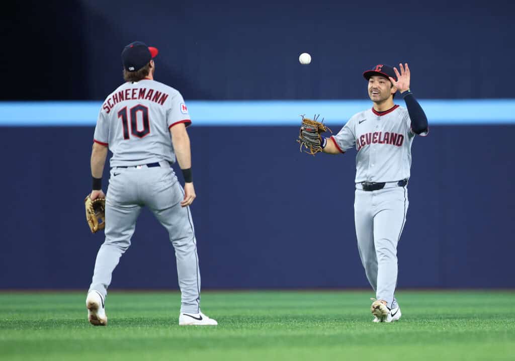 TORONTO, ON - APRIL 24: Daniel Schneemann #10 and Steven Kwan #38 of the Cleveland Guardians celebrate the win after the game against the Toronto Blue Jays at Rogers Centre on April 24, 2025 in Toronto, Ontario, Canada.