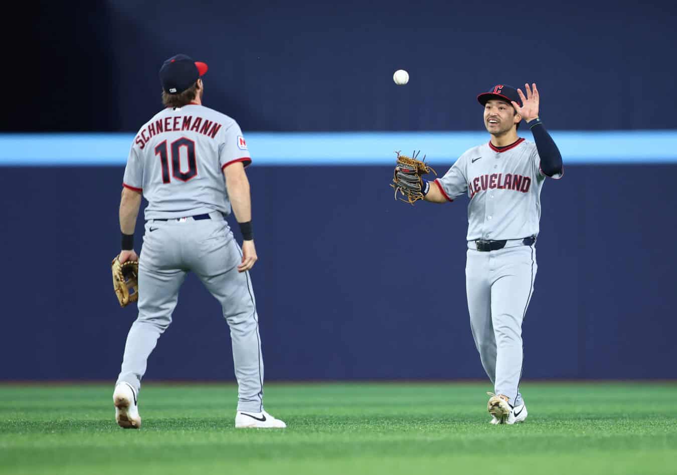 TORONTO, ON - APRIL 24: Daniel Schneemann #10 and Steven Kwan #38 of the Cleveland Guardians celebrate the win after the game against the Toronto Blue Jays at Rogers Centre on April 24, 2025 in Toronto, Ontario, Canada.