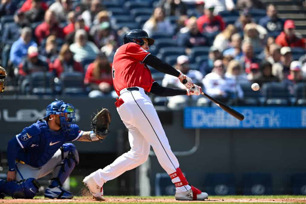 CLEVELAND, OHIO - APRIL 08: Chase DeLauter #24 of the Cleveland Guardians hits a two-run double during the first inning against the Kansas City Royals at Progressive Field on April 08, 2026 in Cleveland, Ohio.
