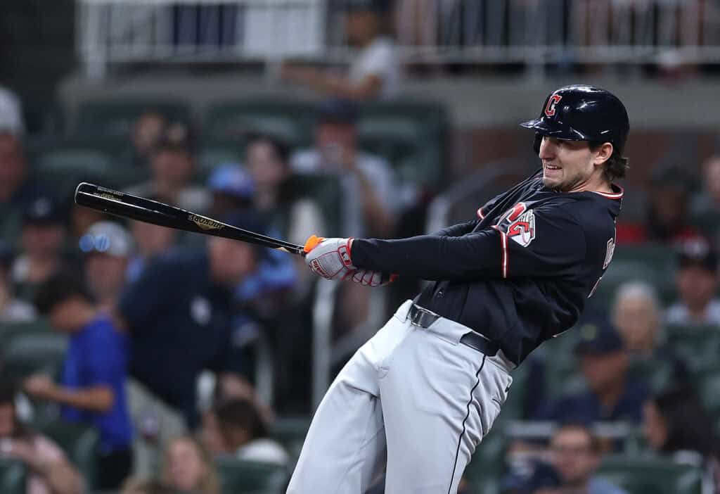ATLANTA, GEORGIA - APRIL 11: Chase DeLauter #24 of the Cleveland Guardians hits a RBI double in the eighth inning against the Atlanta Braves at Truist Park on April 11, 2026 in Atlanta, Georgia.