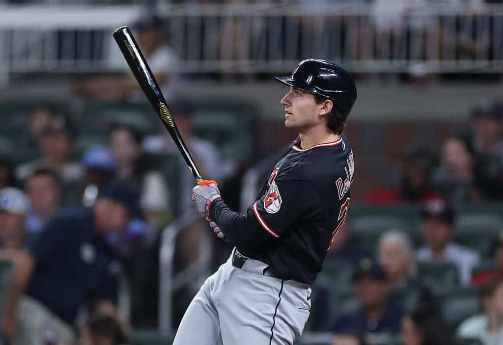 ATLANTA, GEORGIA - APRIL 11: Chase DeLauter #24 of the Cleveland Guardians hits a RBI double in the eighth inning against the Atlanta Braves at Truist Park on April 11, 2026 in Atlanta, Georgia.