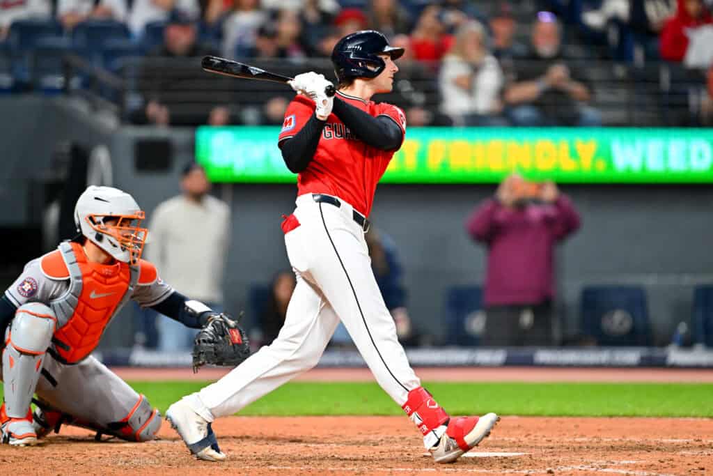CLEVELAND, OHIO - APRIL 21: Chase DeLauter #24 of the Cleveland Guardians hits a three-run triple during the eighth inning against the Houston Astros at Progressive Field on April 21, 2026, in Cleveland, Ohio. The Guardians defeated the Astros 5-8.