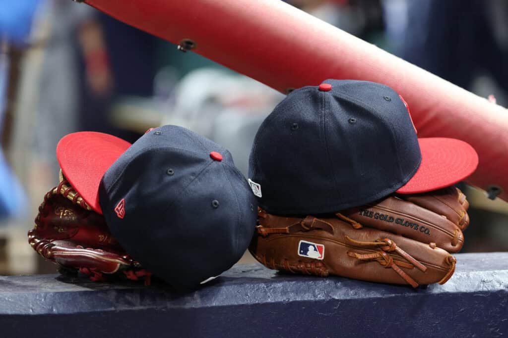 ATLANTA, GEORGIA - APRIL 10: A detailed view of gloves and hats of the Cleveland Guardians in the dugout during the fifth inning against the Atlanta Braves at Truist Park on April 10, 2026 in Atlanta, Georgia.