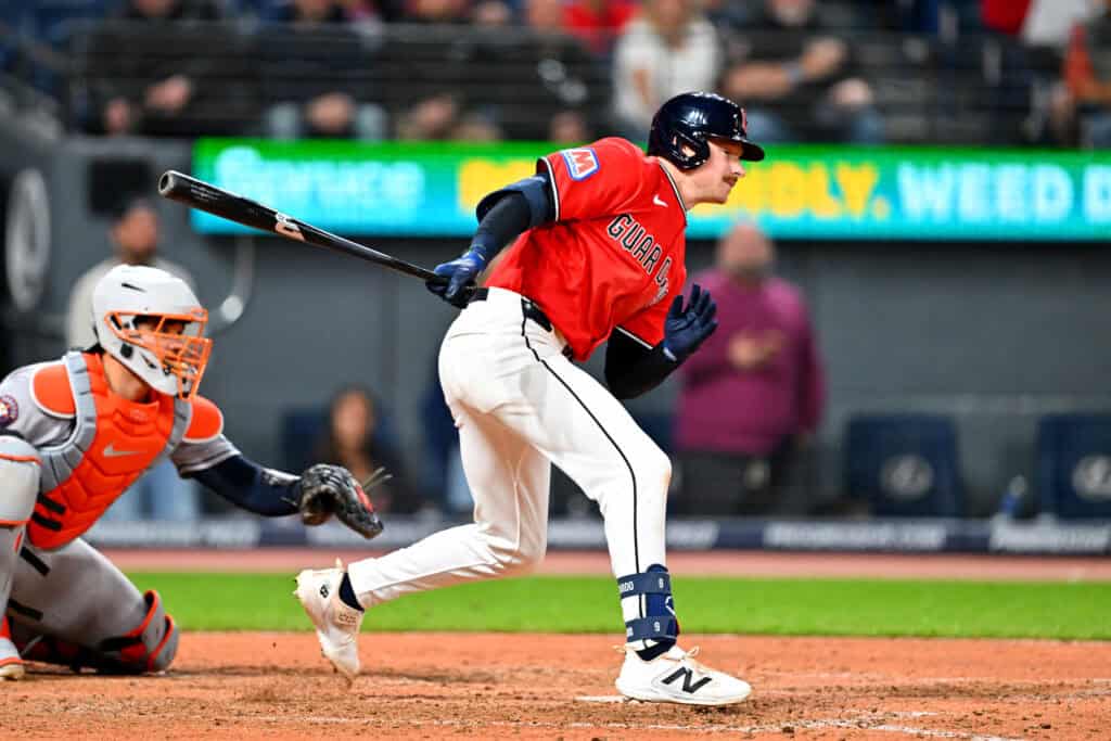 CLEVELAND, OHIO - APRIL 21: Kyle Manzardo #9 of the Cleveland Guardians hits a two-run single in the eighth inning against the Houston Astros at Progressive Field on April 21, 2026 in Cleveland, Ohio. The Guardians defeated the Astros 5-8.