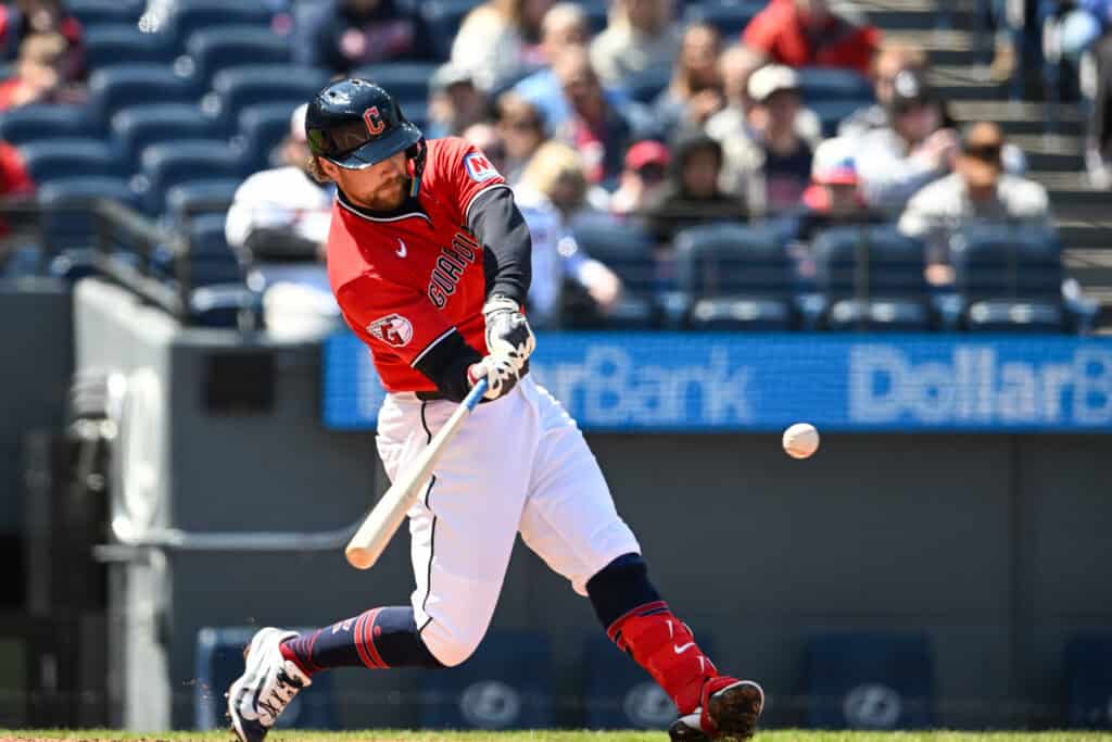 CLEVELAND, OHIO - APRIL 08: Rhys Hoskins #8 of the Cleveland Guardians hits an RBI double during the first inning against the Kansas City Royals at Progressive Field on April 08, 2026 in Cleveland, Ohio.