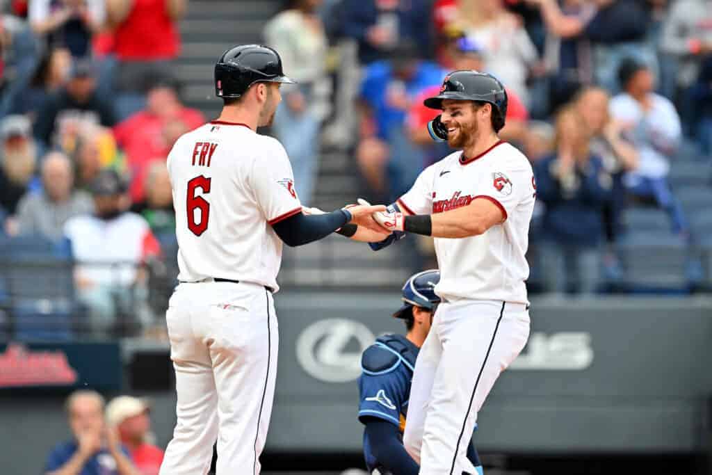 CLEVELAND, OHIO - APRIL 27: David Fry #6 celebrates with Daniel Schneemann #10 of the Cleveland Guardians after both scored on a homer by Schneemann during the fifth inning against the Tampa Bay Rays at Progressive Field on April 27, 2026 in Cleveland, Ohio.