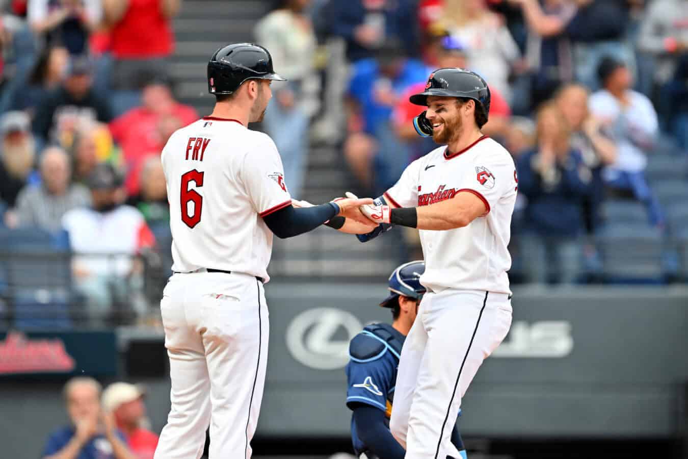 CLEVELAND, OHIO - APRIL 27: David Fry #6 celebrates with Daniel Schneemann #10 of the Cleveland Guardians after both scored on a homer by Schneemann during the fifth inning against the Tampa Bay Rays at Progressive Field on April 27, 2026 in Cleveland, Ohio.